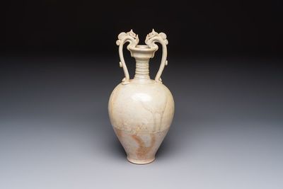 A Chinese straw-glazed pottery amphora with double dragon-shaped handles, Tang
