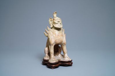 A Chinese straw-glazed stoneware 'earth spirit', Sui (581-617)