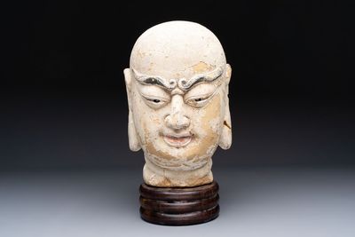 A Chinese stucco head of a Luohan, Qing