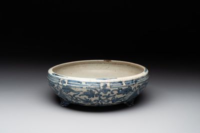 RETURNED 10/12/24 A Chinese Swatow blue and white crackle-glazed 'peonies and trigrams' tripod censer, Ming