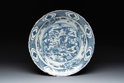 A Chinese Swatow blue and white dish with deer in a landscape, Ming