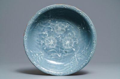 A Chinese Swatow celadon slip-decorated blue-ground dish, Ming
