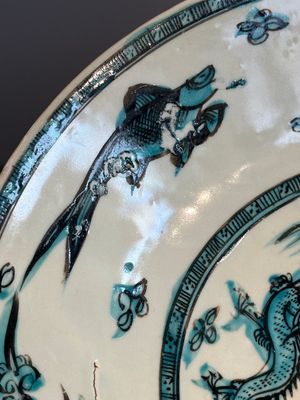A Chinese Swatow slip-decorated blue-glazed 'chrysanthemum' dish and a turquoise- and black-enamelled 'dragon' dish, Ming — photo 17