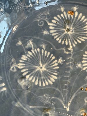 A Chinese Swatow slip-decorated blue-glazed 'chrysanthemum' dish and a turquoise- and black-enamelled 'dragon' dish, Ming — photo 2