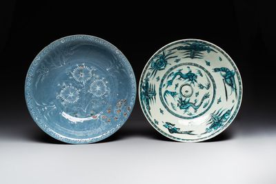 A Chinese Swatow slip-decorated blue-glazed 'chrysanthemum' dish and a turquoise- and black-enamelled 'dragon' dish, Ming