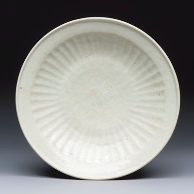 A Chinese Swatow slip-decorated white-ground dish, Ming