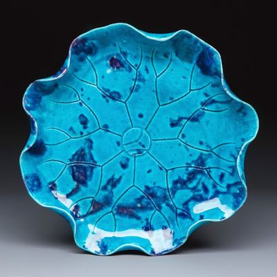 A Chinese turquoise-glazed purple-splashed 'Lotus Leaf' dish, Kangxi