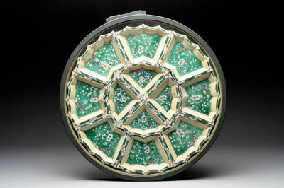 A Chinese verte biscuit 12-piece 'plum blossoms' sweetmeat set in a case, Kangxi
