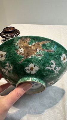 A Chinese verte biscuit 'animals among waves' bowl and a wooden stand, Jiajing mark, Kangxi — photo 15