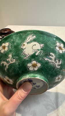 A Chinese verte biscuit 'animals among waves' bowl and a wooden stand, Jiajing mark, Kangxi — photo 16