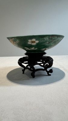 A Chinese verte biscuit 'animals among waves' bowl and a wooden stand, Jiajing mark, Kangxi — photo 4