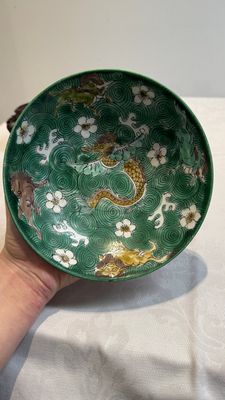 A Chinese verte biscuit 'animals among waves' bowl and a wooden stand, Jiajing mark, Kangxi — photo 5
