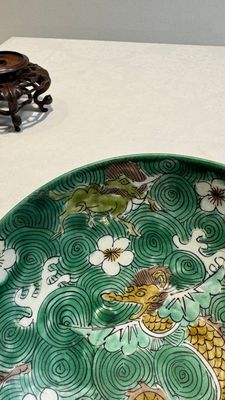 A Chinese verte biscuit 'animals among waves' bowl and a wooden stand, Jiajing mark, Kangxi — photo 7