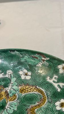 A Chinese verte biscuit 'animals among waves' bowl and a wooden stand, Jiajing mark, Kangxi — photo 8