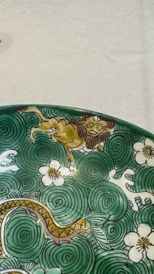 A Chinese verte biscuit 'animals among waves' bowl and a wooden stand, Jiajing mark, Kangxi — photo 9