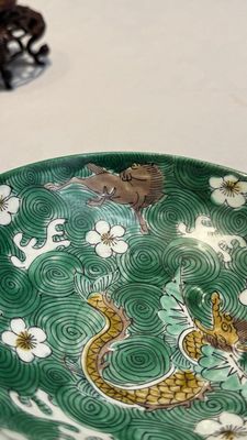 A Chinese verte biscuit 'animals among waves' bowl and a wooden stand, Jiajing mark, Kangxi — photo 10