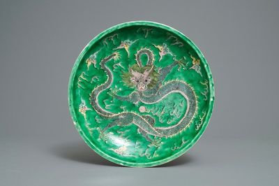 A Chinese verte biscuit 'dragon' charger, Kangxi mark, 19th C.