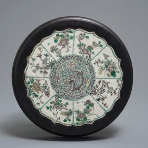 A Chinese verte biscuit lotus-shaped dragon plaque mounted in a wooden stand, Kangxi — photo 1