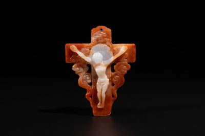 A Chinese white and red jade 'crucifix' pendant, 19th C.