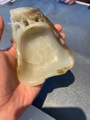 A Chinese white and russet jade lotus-form brush washer, Qing — photo 1