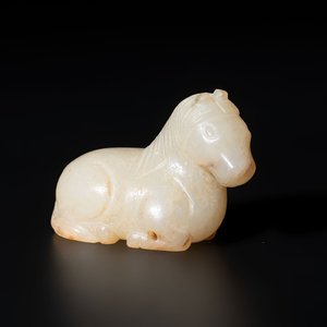 A Chinese white and russet jade pendant in the form of a horse, Song/Ming — photo 1