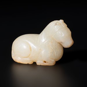 A Chinese white and russet jade pendant in the form of a horse, Song/Ming — photo 2