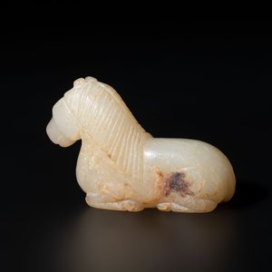 A Chinese white and russet jade pendant in the form of a horse, Song/Ming — photo 4