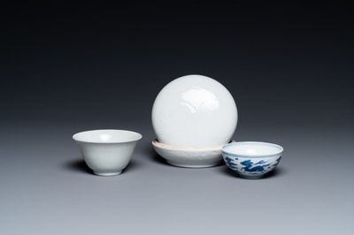 A Chinese white-glazed bowl, a small blue and white bowl and a covered box with incised design, Ming and Qing