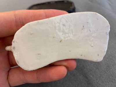 A Chinese white-glazed brush rest in the shape of a resting horse in a wavy sea, 18th C. — photo 7