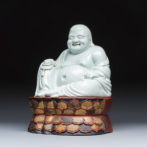 A Chinese white-glazed Milefo Buddha on a gilt-lacquered wooden lotus throne — photo 1