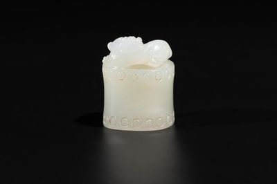 A Chinese white jade carving of a chilong reclining on bamboo, Qing