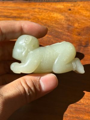 A Chinese white jade carving of a reclining boy, Qing — photo 1