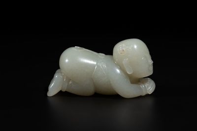 A Chinese white jade carving of a reclining boy, Qing