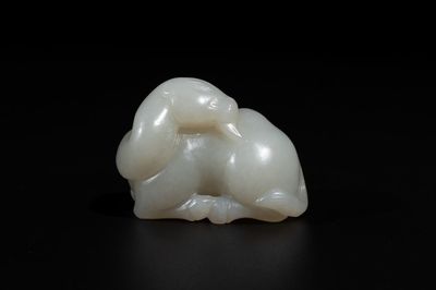 A Chinese white jade carving of a reclining camel, Qing