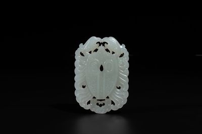 A Chinese white jade 'double phoenix' plaque, Qianlong mark and possibly of the period