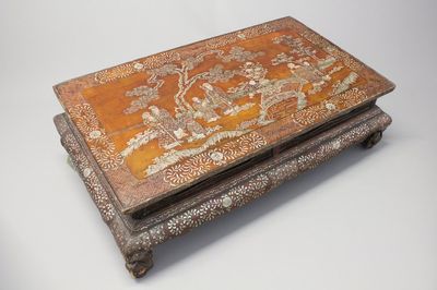 A Chinese wood and mother of pear inlaid tea table, 19th C.