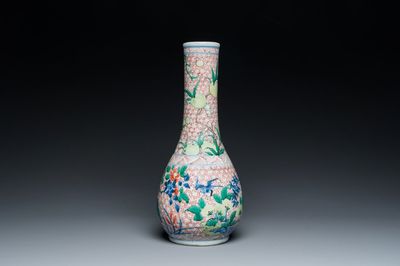 A Chinese wucai bottle vase with birds surrounded by fruits and foliage, Transitional period
