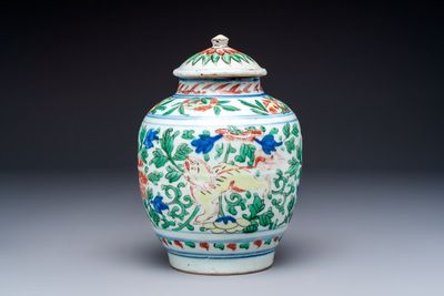 A Chinese wucai ‘Buddhist Lion’ vase and cover, Transitional period