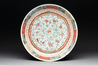 A Chinese wucai dish with floral design, Kangxi mark and of the period
