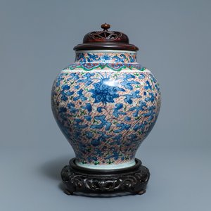 A Chinese wucai 'lotus scroll' jar with wooden cover and stand, Transitional period — 照片 1