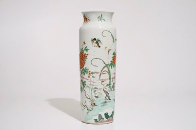 A Chinese wucai sleeve vase with birds in a blossoming landscape, 19th C.