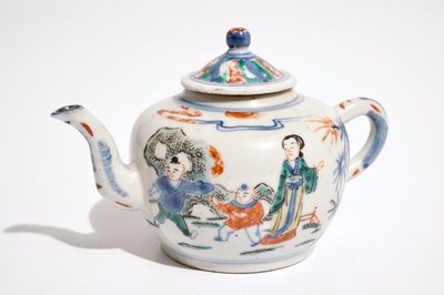 A Chinese wucai teapot and cover with figures in a garden, 19th C.