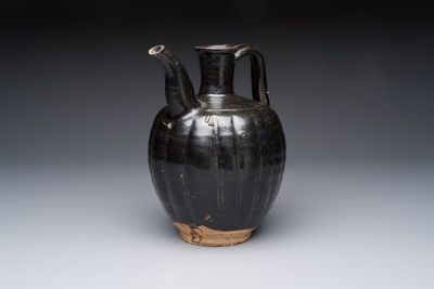 A Chinese Yaozhou black-glazed ewer with a ribbed body, Song