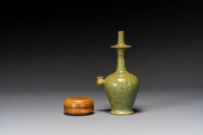 A Chinese yellow-glazed marbled covered box and a green-glazed marbled ewer, Tang/Song