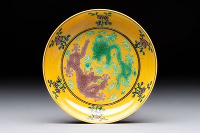 A Chinese yellow-ground aubergine and green-enamelled 'dragon' saucer, Daoguang mark and of the period