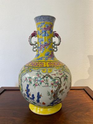 A Chinese yellow-ground famille rose 'nine peaches' bottle vase, Jiaqing — photo 1