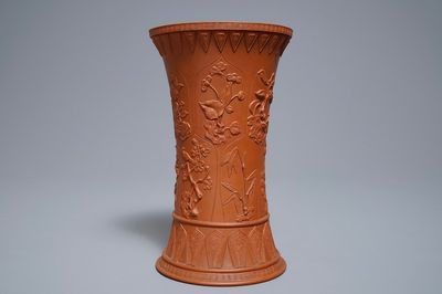 A Chinese Yixing stoneware beaker vase with applied floral design, Kangxi