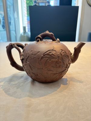 A Chinese Yixing stoneware 'squirrels among grape vines' teapot and cover, Kangxi — photo 1
