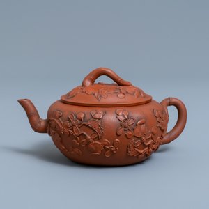 A Chinese Yixing stoneware teapot and cover with applied floral design, Kangxi — photo 1