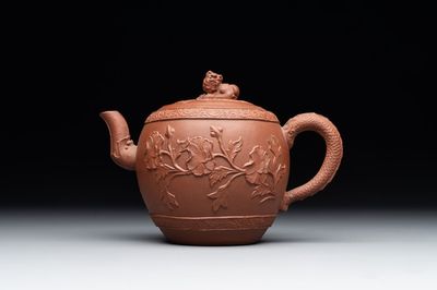 A Chinese Yixing stoneware teapot with relief design, Kangxi